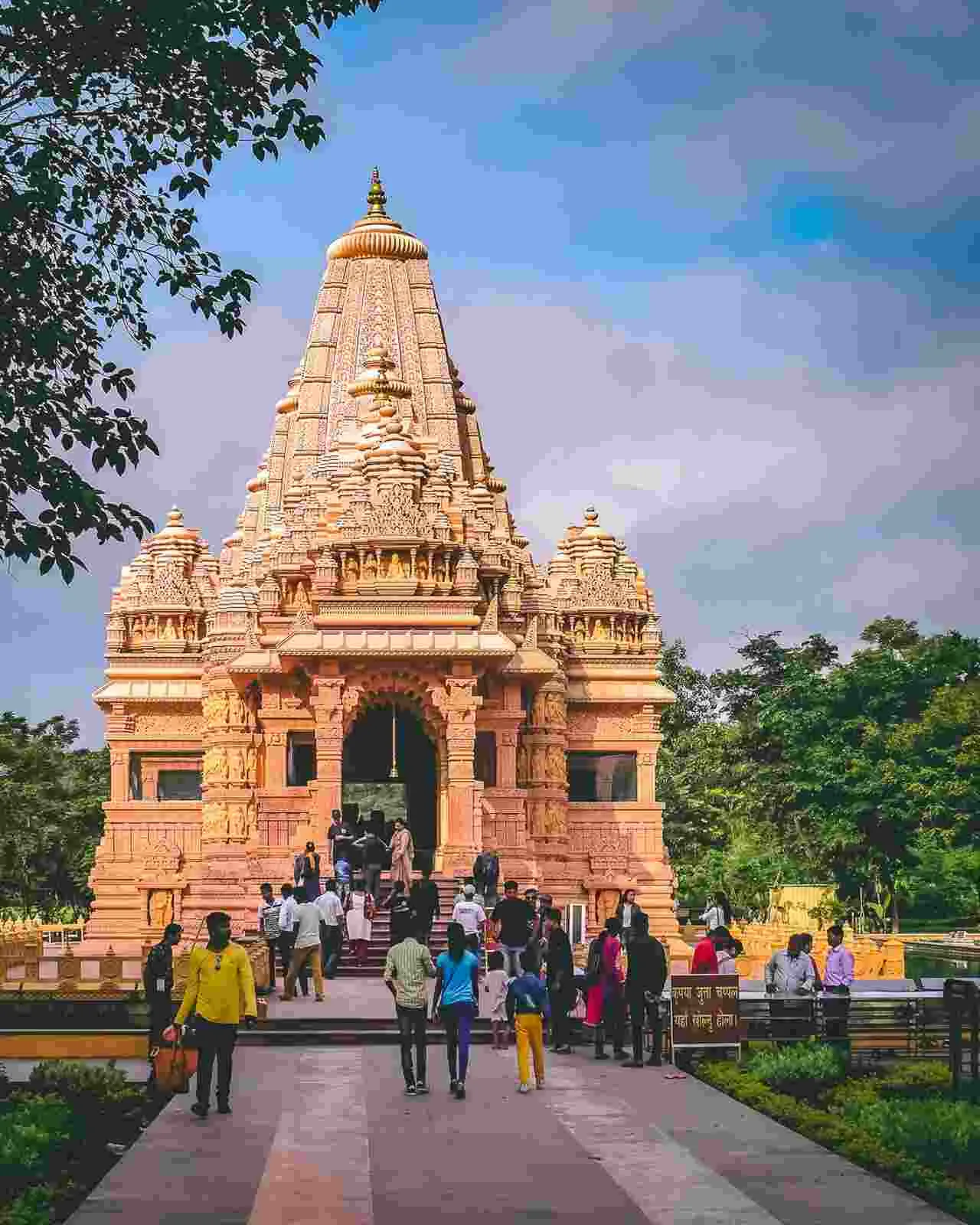 Devotees visiting the ancient Arunai Shiv Temple, a historic pilgrimage site in Haryana, with taxi services available